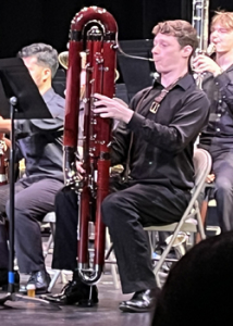 person playing a large contrabassoon